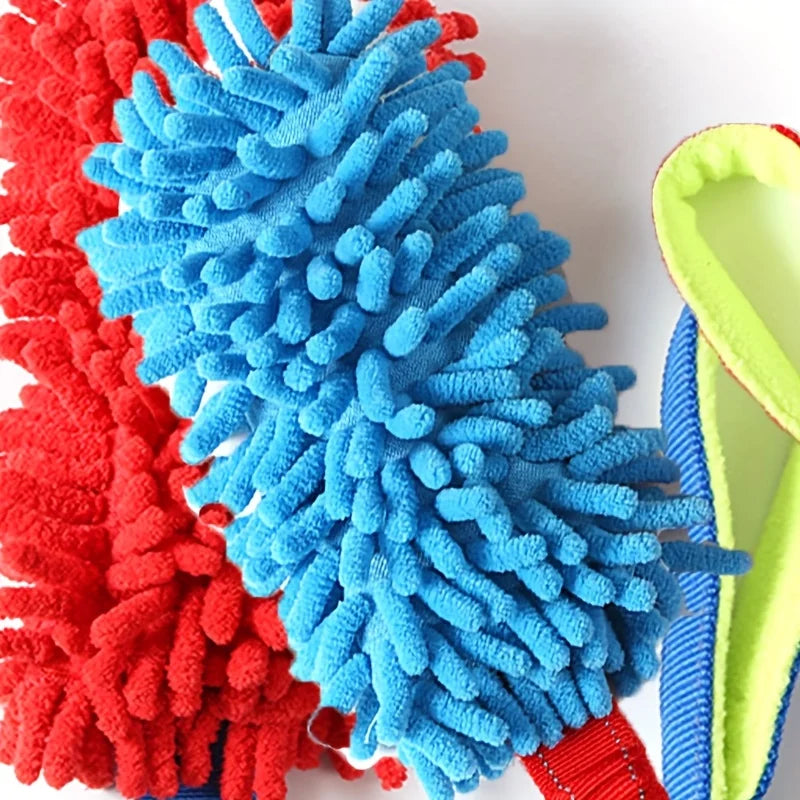 A close-up of a colorful plush pull rope toy featuring red, blue, and green textured fibers.
