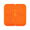 Orange silicone lick mat for dog bathing and slow food training with textured surfaces