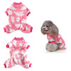 Pink and white patterned cozy winter overalls for a small dog