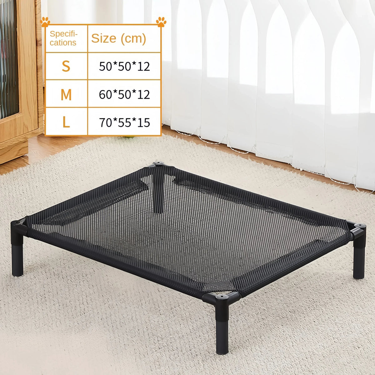 A black portable folding pet bed mesh surface displayed on a white carpet with size options listed nearby.