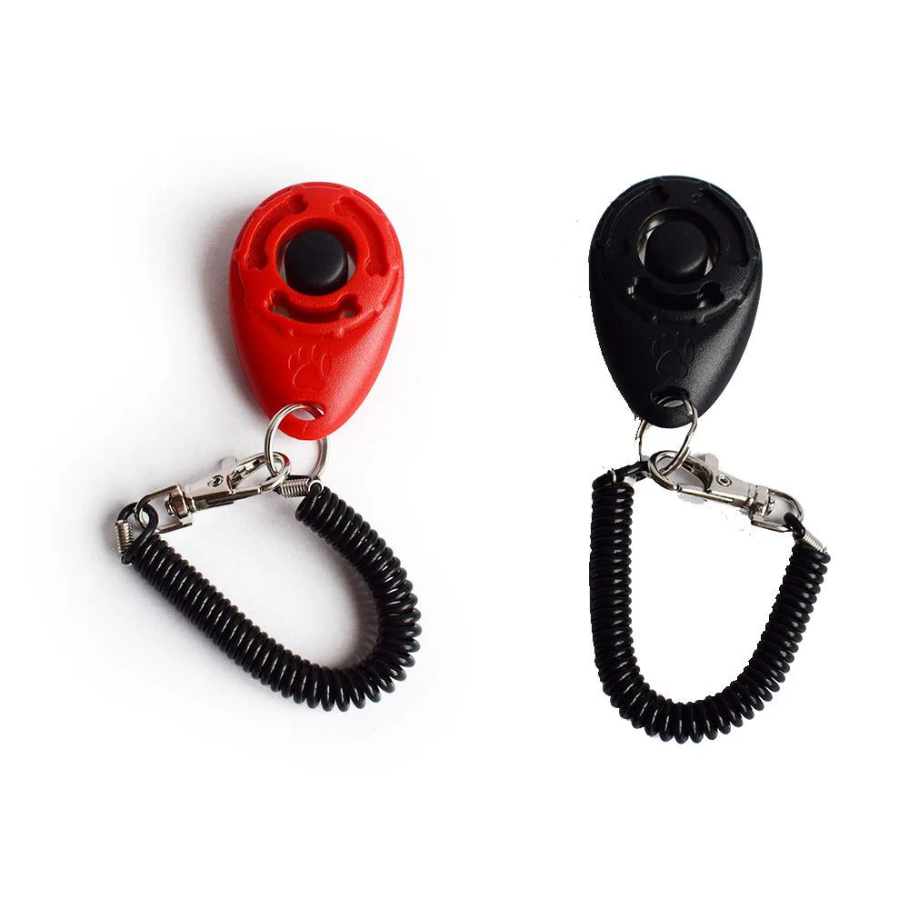 Un clicker pour dressage d'animaux rouge et noir avec sangle réglable.