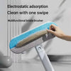 A hand is using a blue and gray electrostatic adsorption multifunctional bristle brush for pet hair removal.