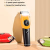 An orange pet shaver is shown with a display, positioned next to other grooming tools on a wooden surface.
