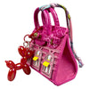 A handcrafted mini house-shaped pink bag with a puppy keychain charm.