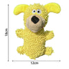 A yellow, fluffy plush toy resembling a dog's head with large eyes and a black nose.