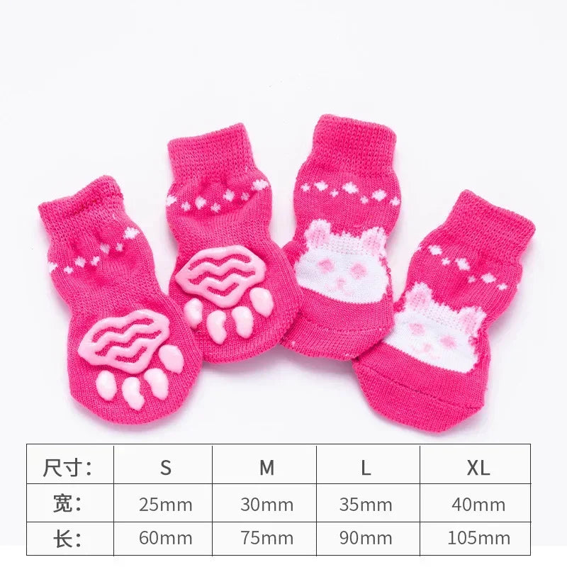 A set of pink knitted pet dog and cat shoes in various sizes S to XL