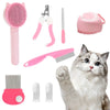 Set de aseo para mascotas rosa con cepillo, tijeras y peine, junto a un gato.
