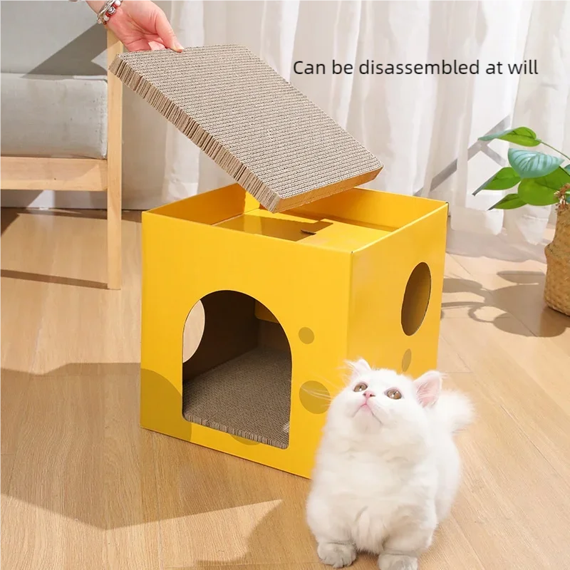 A yellow cat scratching house is shown with a cat looking up at the cardboard scratching board.