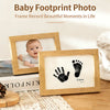 A wooden photo frame displaying a baby's footprint and the name Emma, used to record beautiful moments in life.