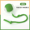 A green, motion-activated smart pet ball with a flexible cord attached.