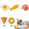 A collection of natural loofah cat chew toys and catnip toys, including a sun-shaped toy, a paw print toy, and a yellow ring 