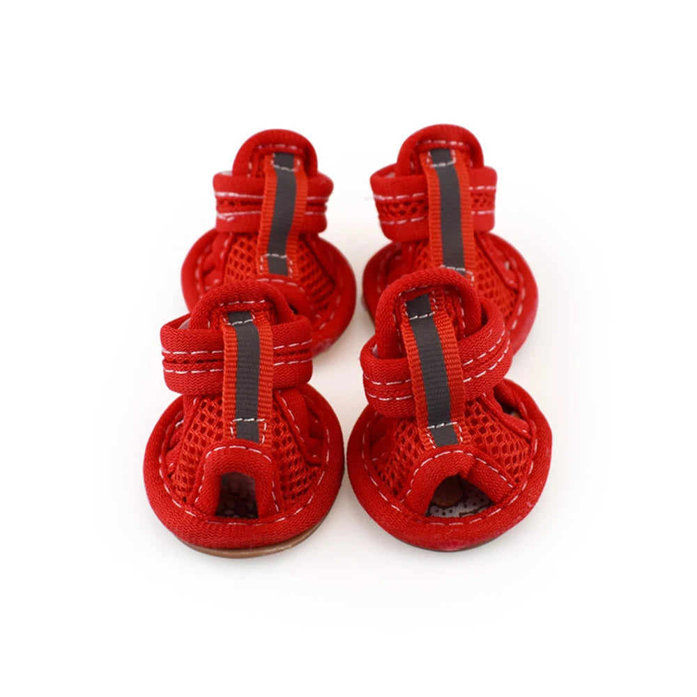 A pair of red summer dog and cat walking shoes with black laces