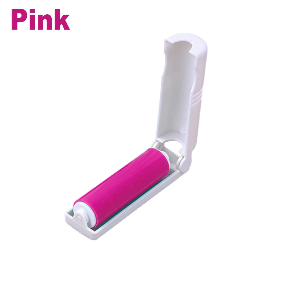 A pink reusable washable lint roller with a white handle and pink roller core.