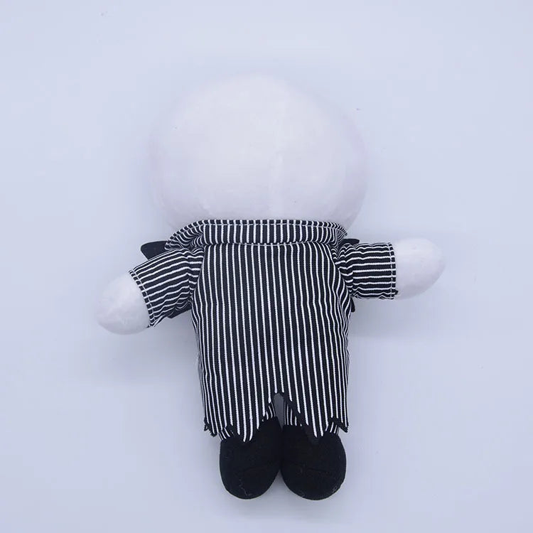 A white cartoon skeleton dog plush toy wearing a black and white striped outfit and black boots.