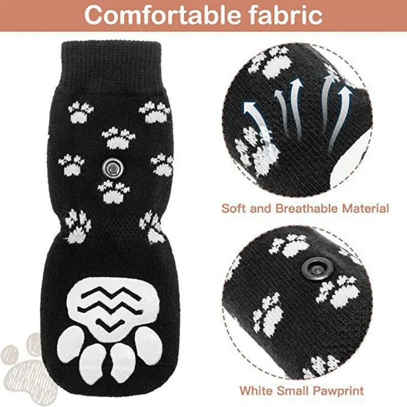 Black anti-slip dog socks with white pawprint traction straps shown in detail.