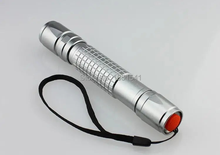 Silver cylindrical laser pointer with a black strap and an orange tip