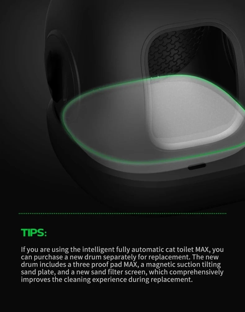 A close-up view of a black smart cat toilet with a glowing green light, showing the litter mat area.