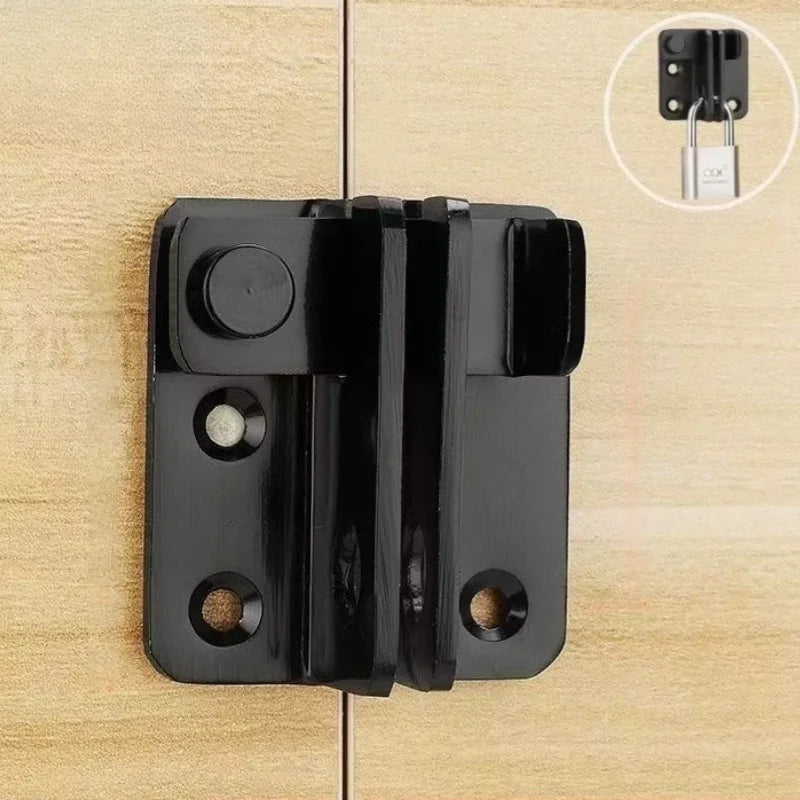 A black sliding bolt lock mounted on a wooden surface, showing the mechanism and a close-up of the keyhole.