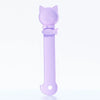 A light purple long-handled pet food dispensing spoon with a cat head design.