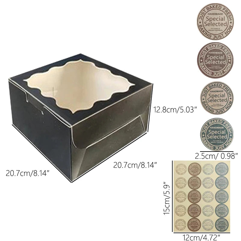 A black window cake box with a clear top, shown from above and displaying various decorative labels.