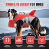 A black and white dog wearing a red swim life jacket on a boat, demonstrating strong buoyancy and rescue assistance.
