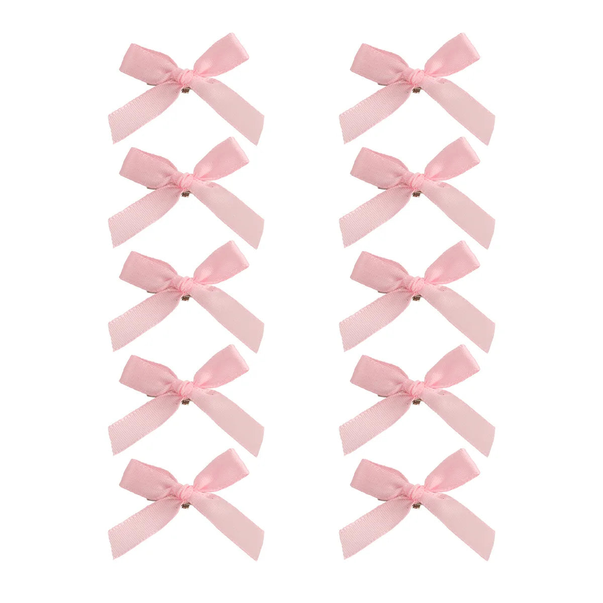 Un set de pinzas para el cabello con lazos de cinta rosa para sujetar el pelo.
