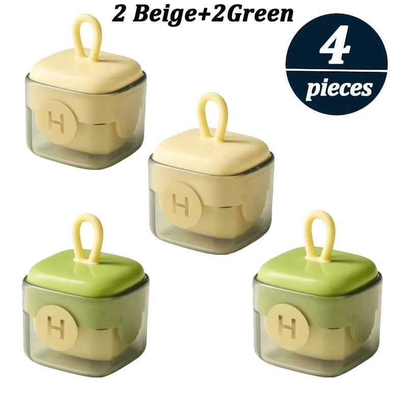 Vier wiederverwendbare Flusenentfernerrollen in Beige und Grün, verpackt als zwei Beige- und zwei Grünteile.