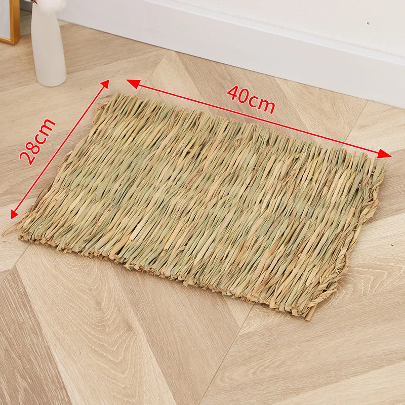 A rectangular mat woven from natural straw placed on a light wooden floor.