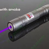 A silver laser beam with purple light is emitted from a device against a dark background.