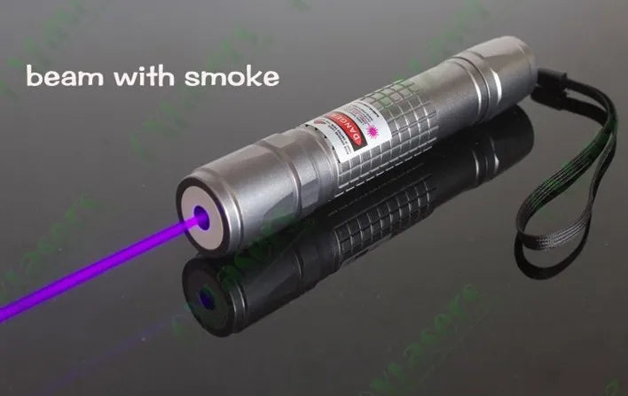 A silver laser beam with purple light is emitted from a device against a dark background.