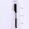A black pet face comb with a metal handle and bristles, shown against a white background.