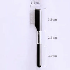 A black pet face comb with a metal handle and bristles, shown against a white background.