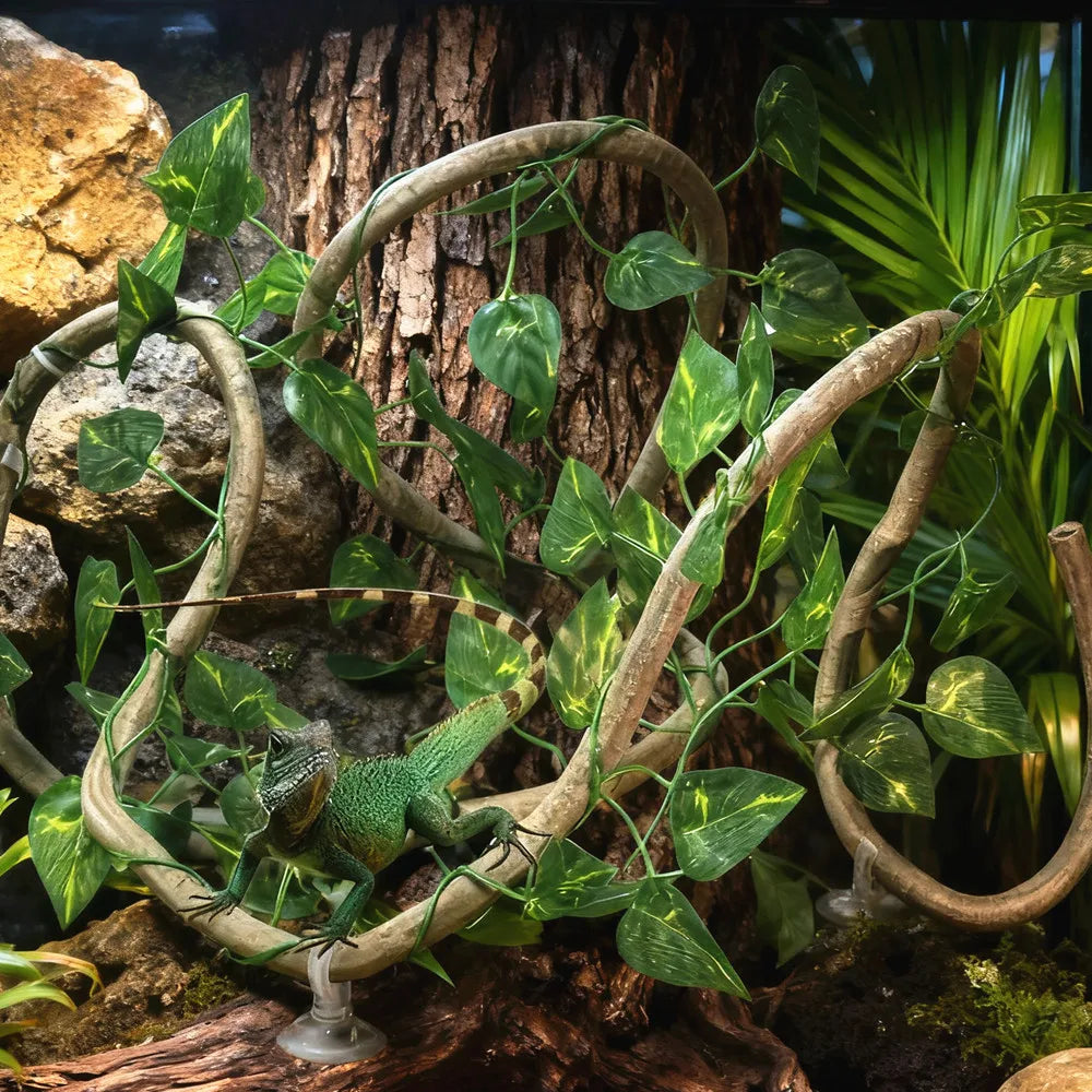 Realistic artificial reptile vines with green leaves winding around a tree trunk for terrarium decor