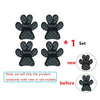 A set of black pet anti-slip paw protectors for dogs shown with new and old models.