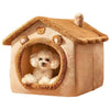 A fluffy dog is visible inside a cozy, round-windowed dog house pet bed with a suede-like exterior.