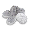 A pack of four gray breathable anti-slip dog walking shoes for pets.