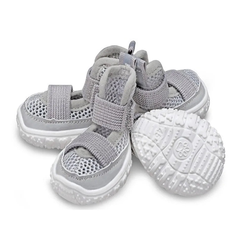 A pack of four gray breathable anti-slip dog walking shoes for pets.