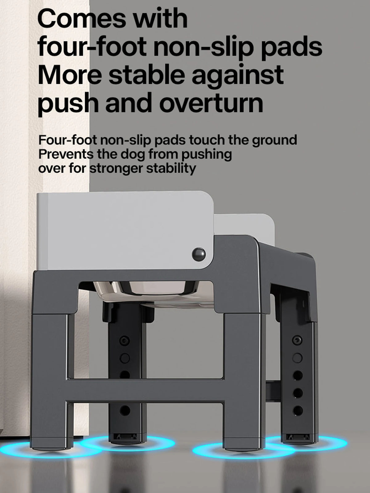 A gray collapsible elevated dog feeder with double stainless steel bowls resting on a floor.