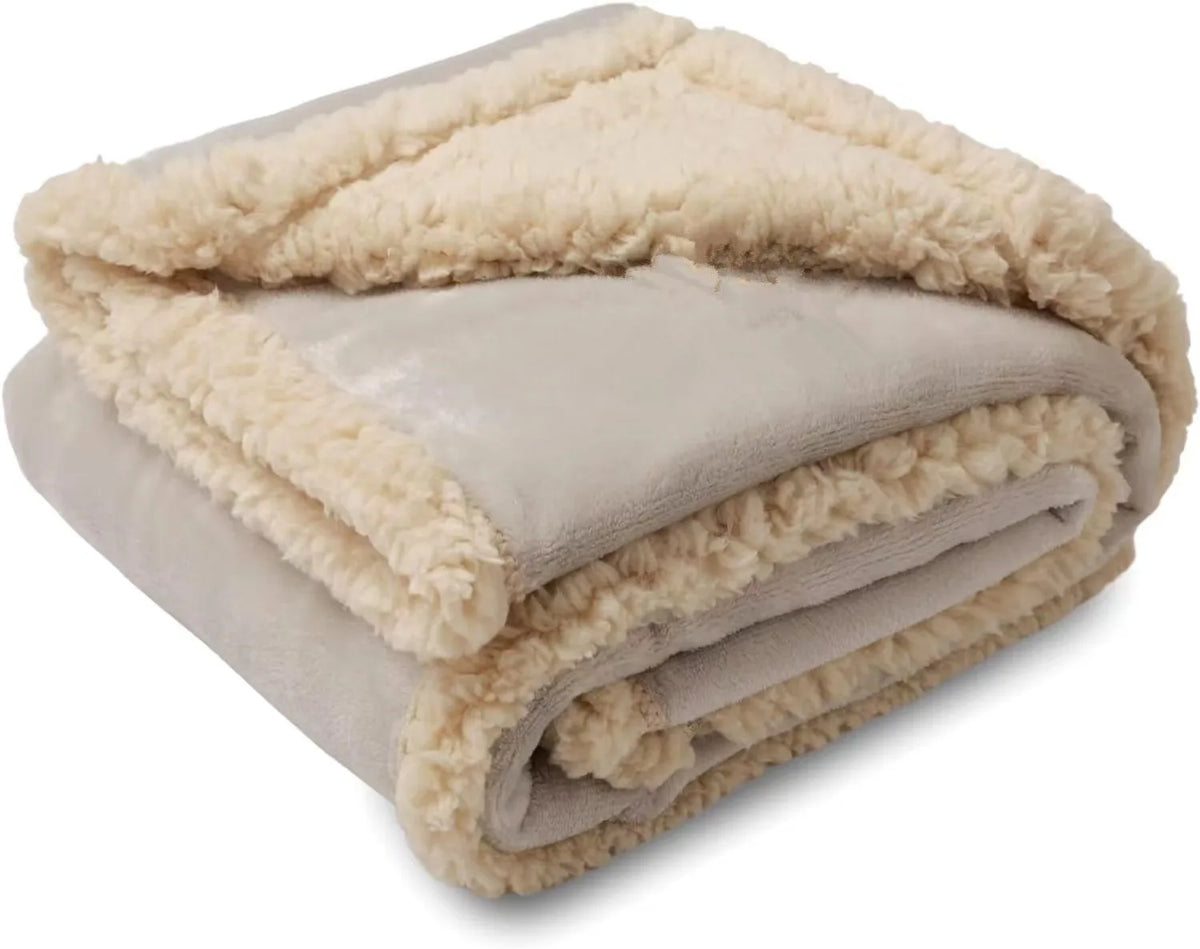A rolled-up beige microfiber blanket with a fluffy trim.