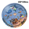 A round, clear plastic sensory mat featuring marine animals like sharks and dolphins on a blue background.