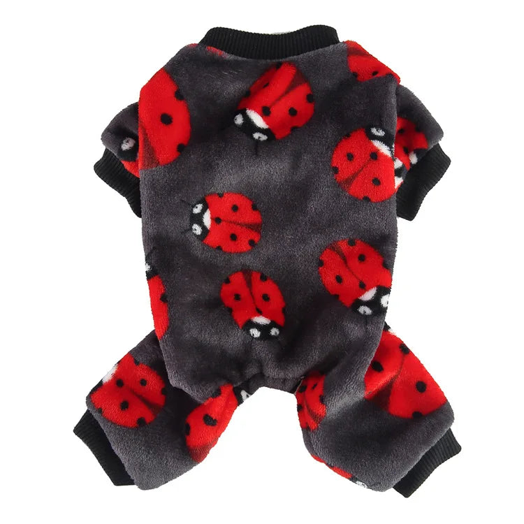 A gray knitted dog outfit featuring a pattern of red ladybugs on the back and legs.