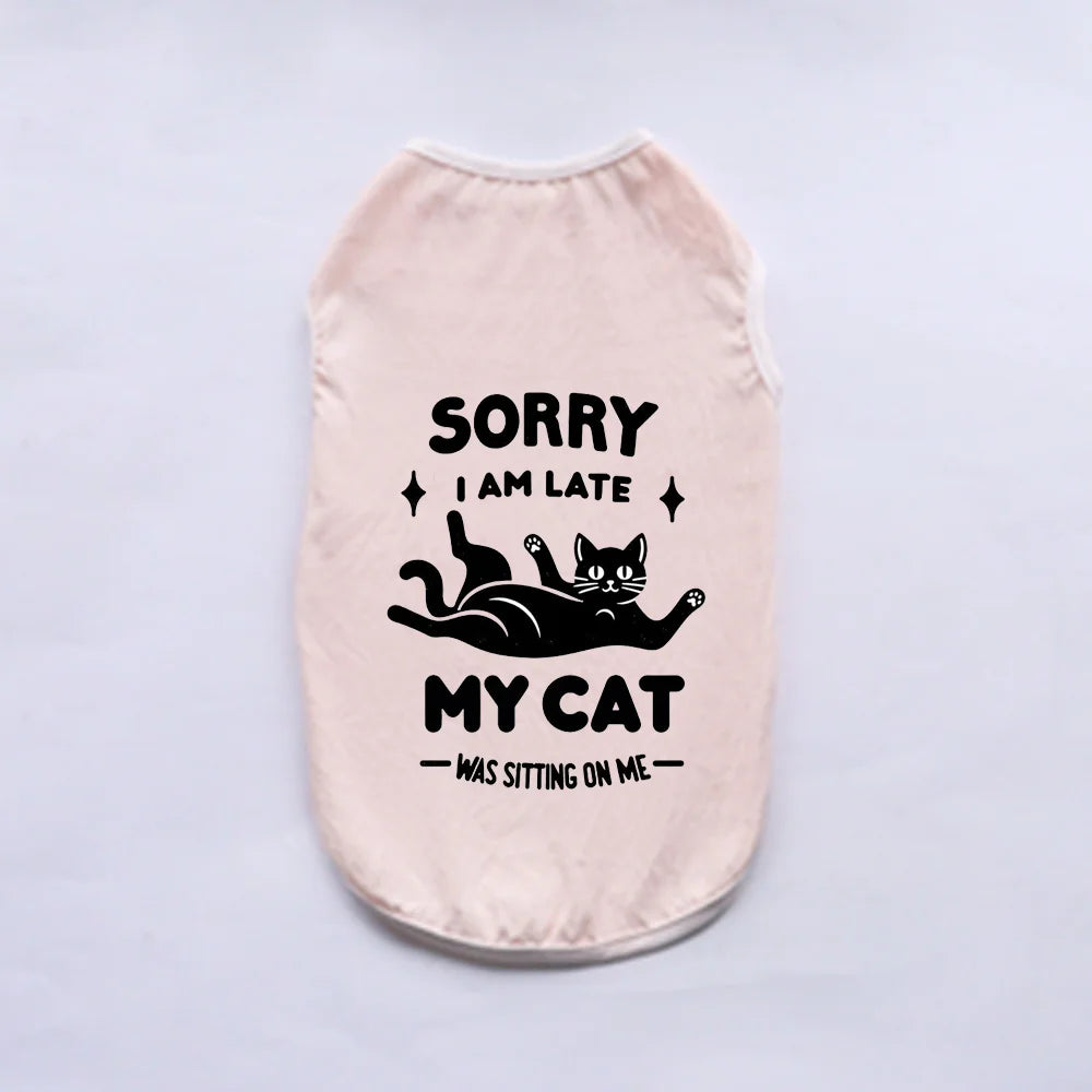 A light pink breathable summer pet vest with black text that reads Sorry I am late my cat was sitting on me