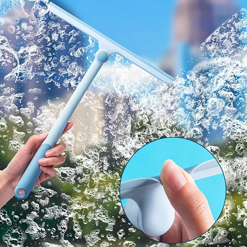 A hand is using a light blue 360° rotating shower squeegee with a silicone holder to clean shower glass.