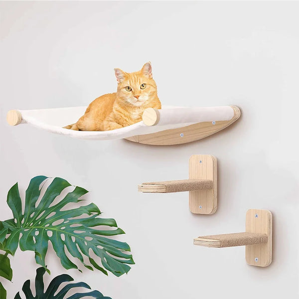A fluffy orange cat is resting in a light wood wall mounted shelf designed for climbing.