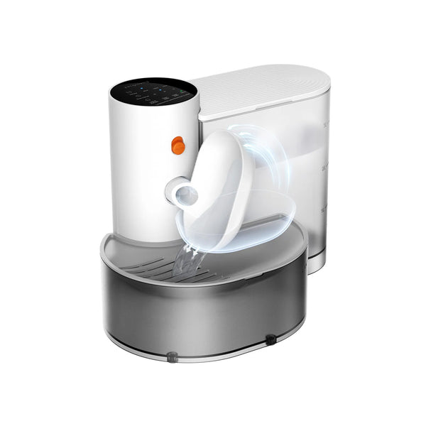 A white automatic pet drinking water dispenser with a clear dispensing spout sitting in a silver base.