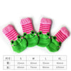 A set of pink and green striped knitted pet shoes for dogs and cats in various sizes