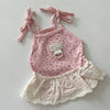 Pink floral print cat dress for a baby with thin straps and lace trim