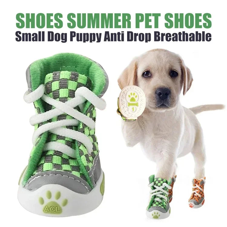 A light-colored puppy wearing green and gray breathable anti-slip dog shoes.