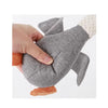 A hand is holding a gray plush dog toy with white and orange accents.