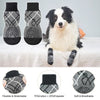 A pack of three anti-slip dog traction socks in black and gray patterns, shown next to a dog.